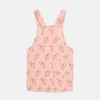 Vestido-peto rosa con estampado cepillo mágico