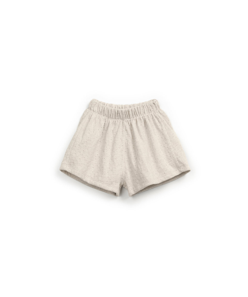 Pantalon corto de punto con puntos inegtrados