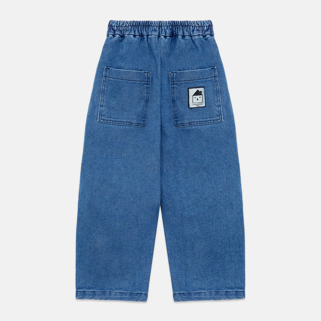 Pantalones denim pom pom