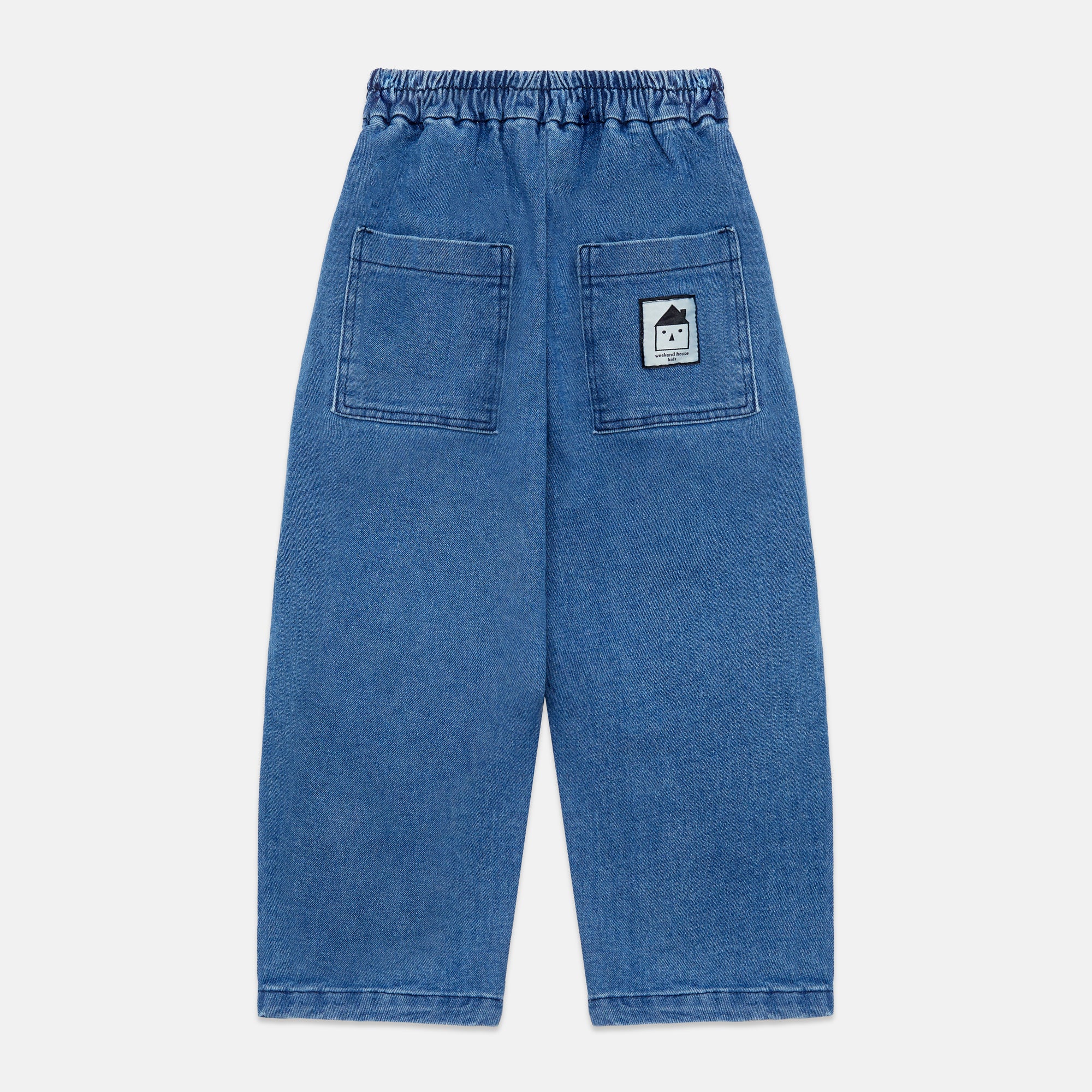 Pantalones denim pom pom