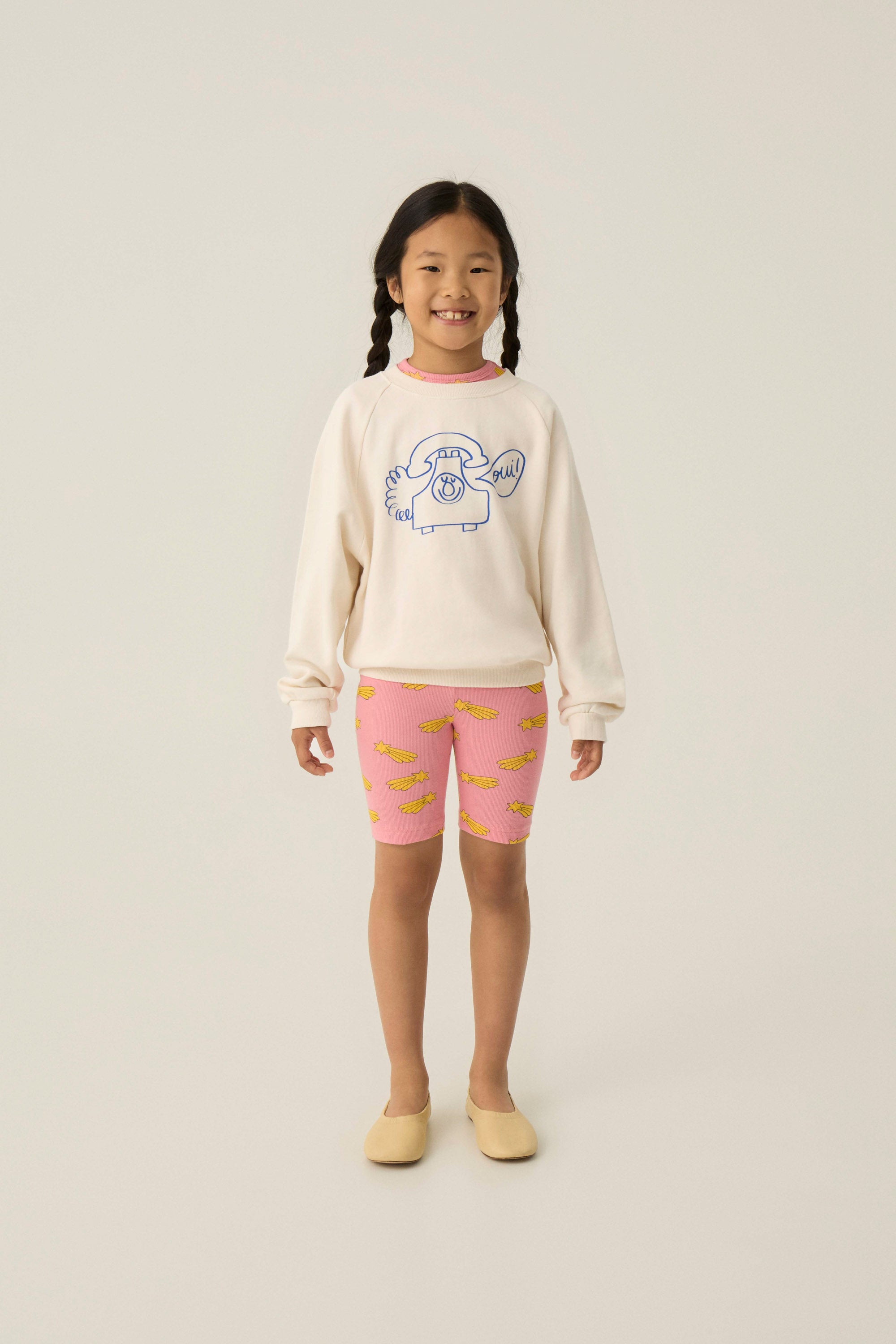 Legging ciclista rosa con estrellas amarillas The Campamento