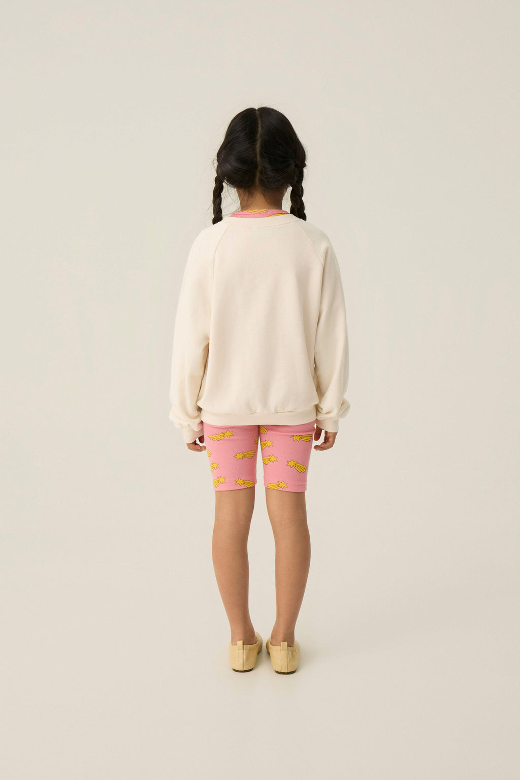 Legging ciclista rosa con estrellas amarillas The Campamento