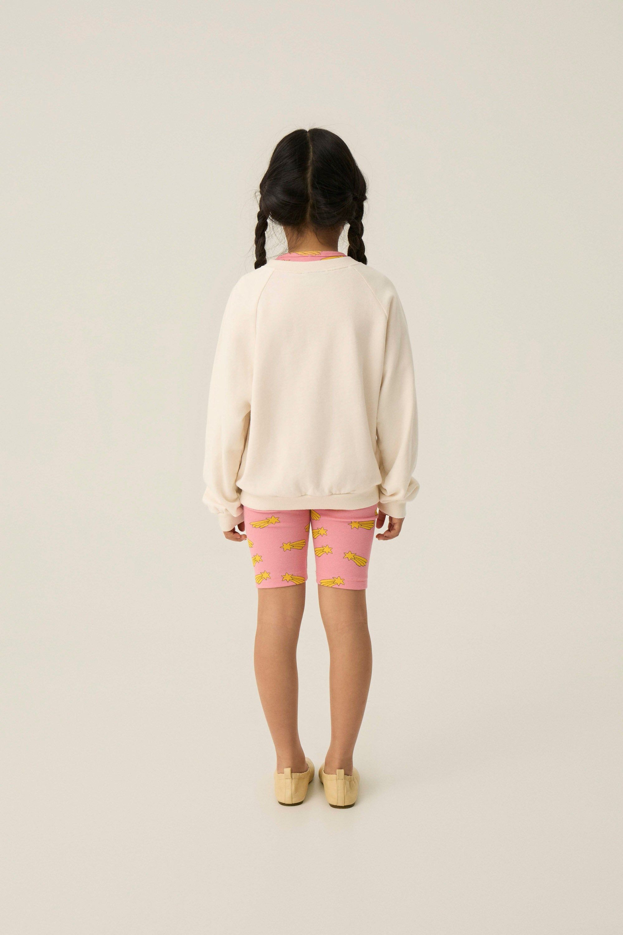 Legging ciclista rosa con estrellas amarillas The Campamento