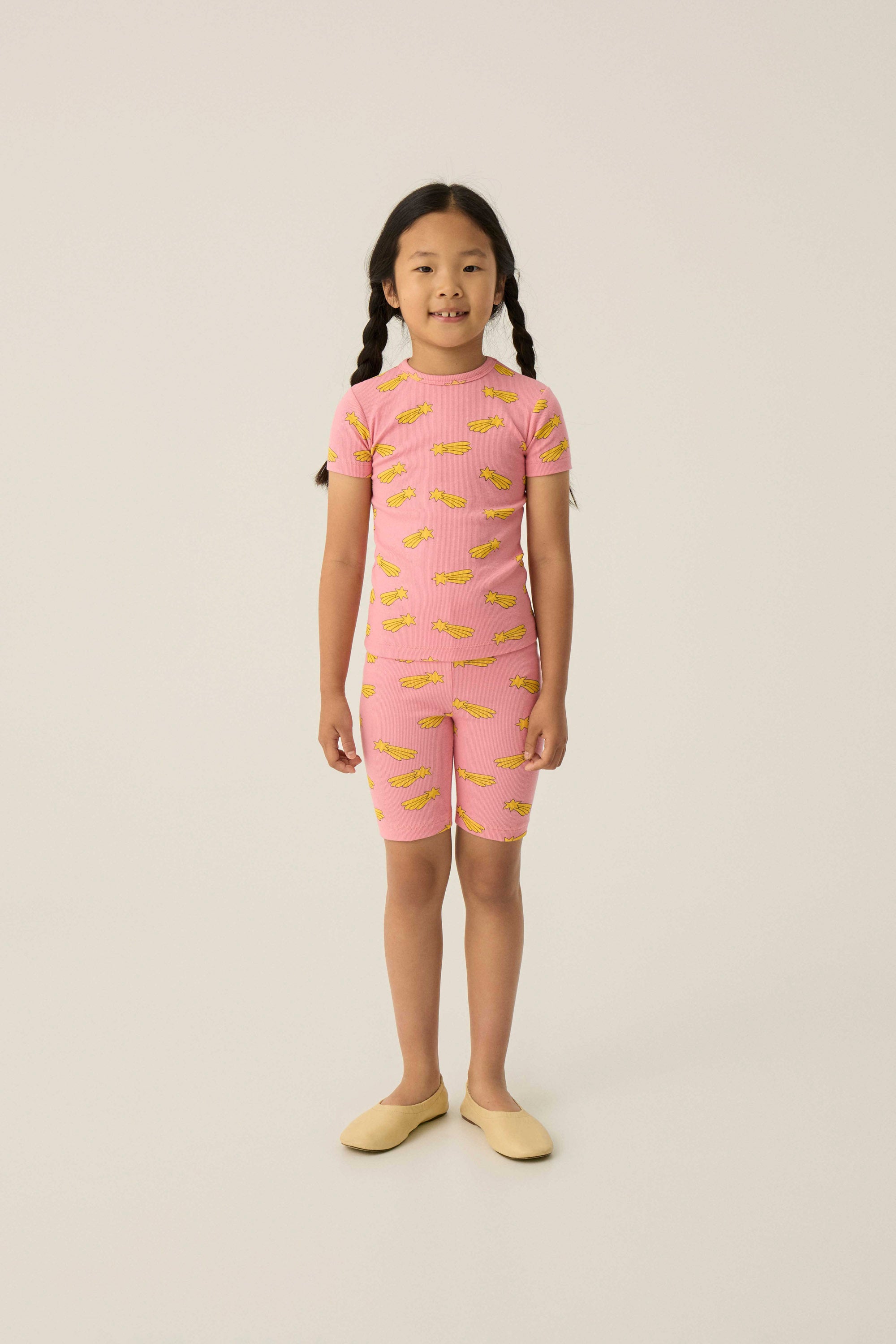 Legging ciclista rosa con estrellas amarillas The Campamento