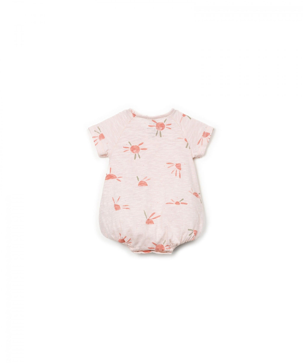 Mono anaranjado estampado soles bebé